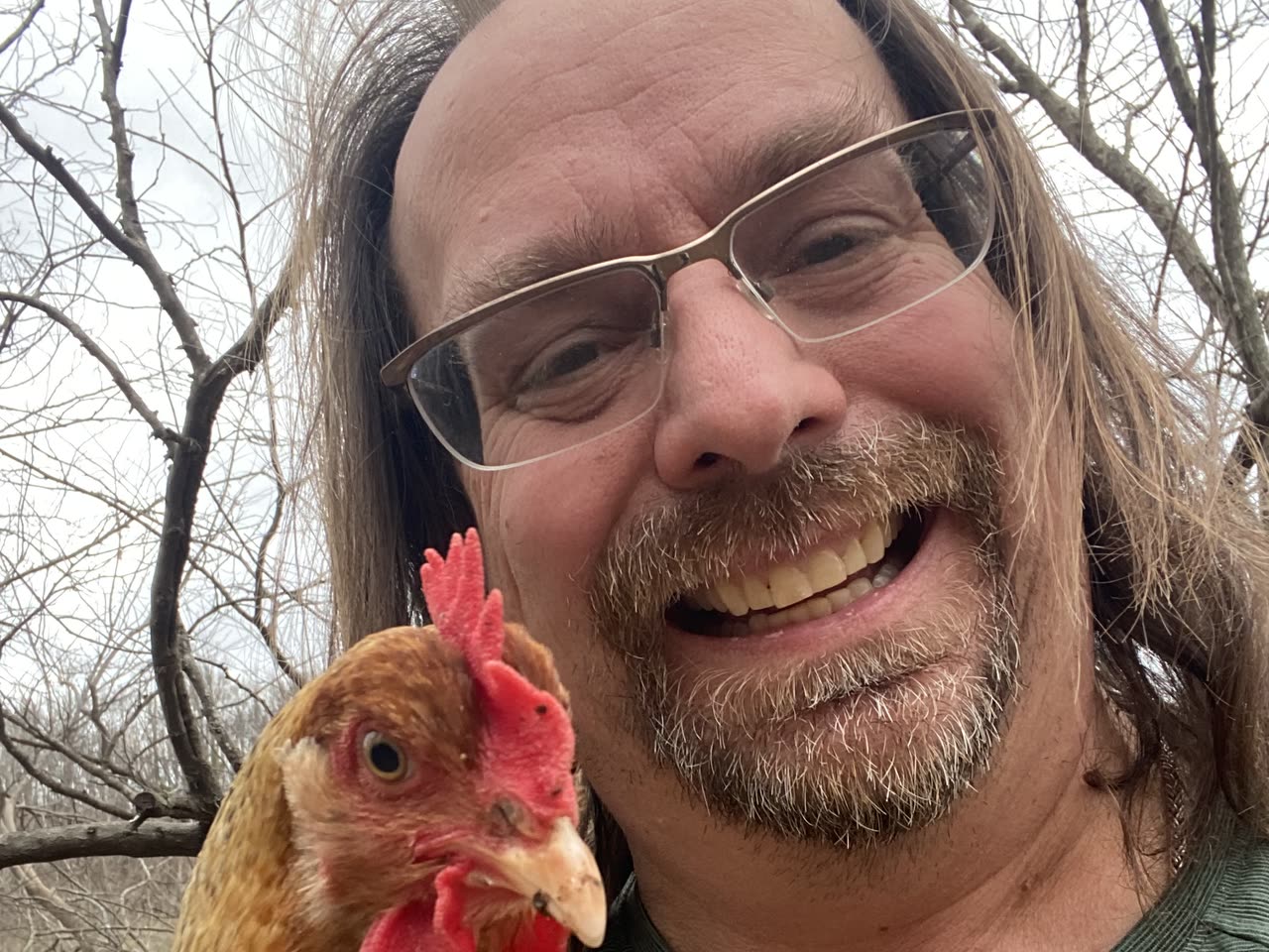 Kevin, founder of bwak.money, holding one of his chickens